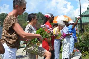 Friends and residents tossed flower pedals into the lake. 