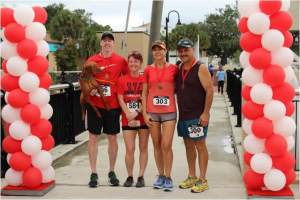 The top four 5K runners posed for a photo.