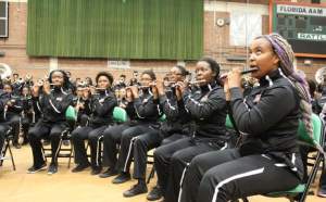 Flute players kept their eyes on the band director as they played.