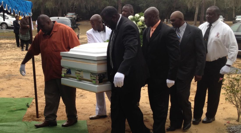 Pallbearers take Barbara Dawson to her final resting place at Watson Cemetery. Photo by St. Clair Murraine 