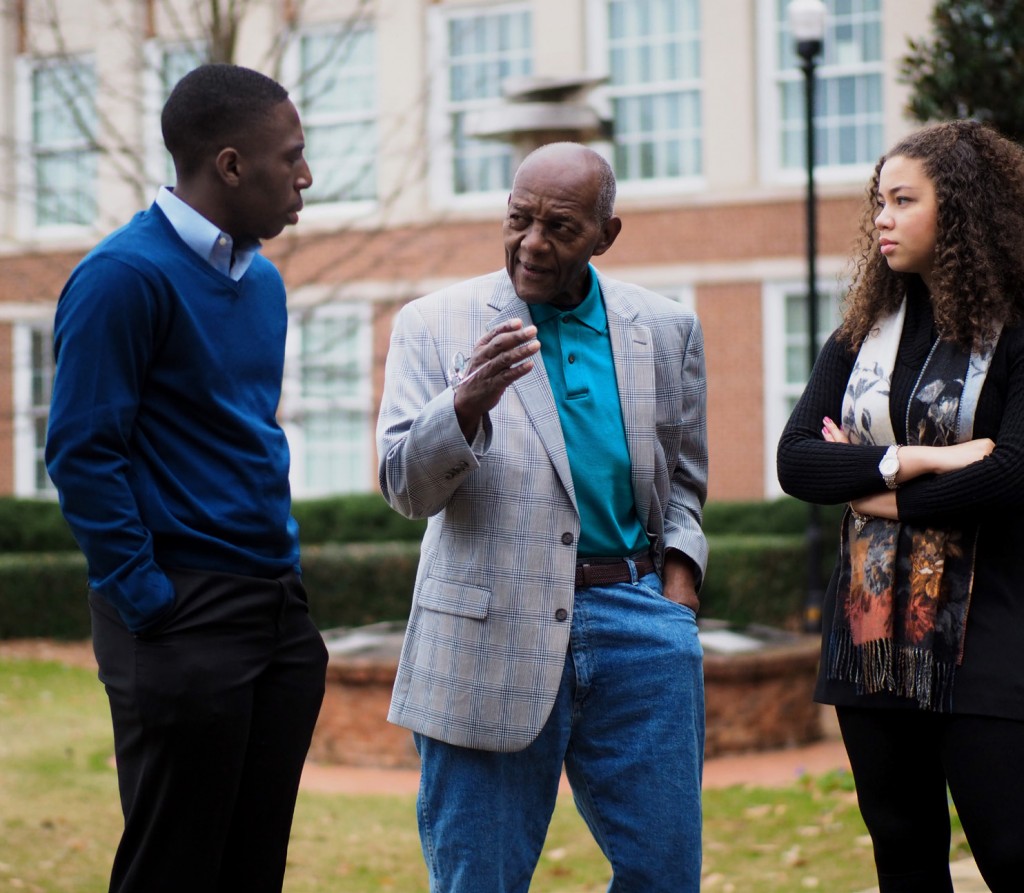 Morehouse College student Jajuan Chain and Georgia State University student Samaria Muhammad listen as civil rights veteran Lonnie King explain principles of leadership. 