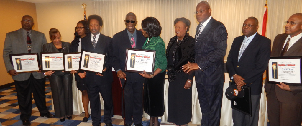 Photo by Devin Powell  Honorees posed with their plaques during the Capital Outlook Honoree Reception.