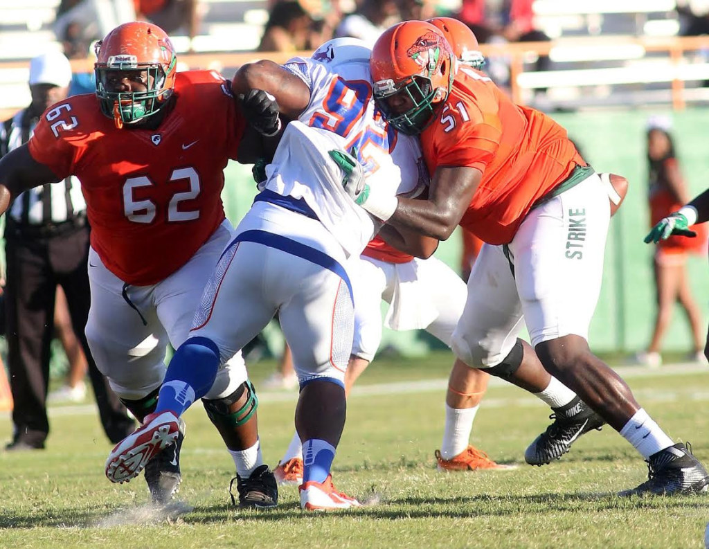 Savannah State’s defensive tackle Brandon Carswell finds it tough to get past offensive linemen Keonte Cash (left) and T.J. Jones early in Saturday’s game a Bragg Stadium. Photo courtesy FAMU Athletics Dept.