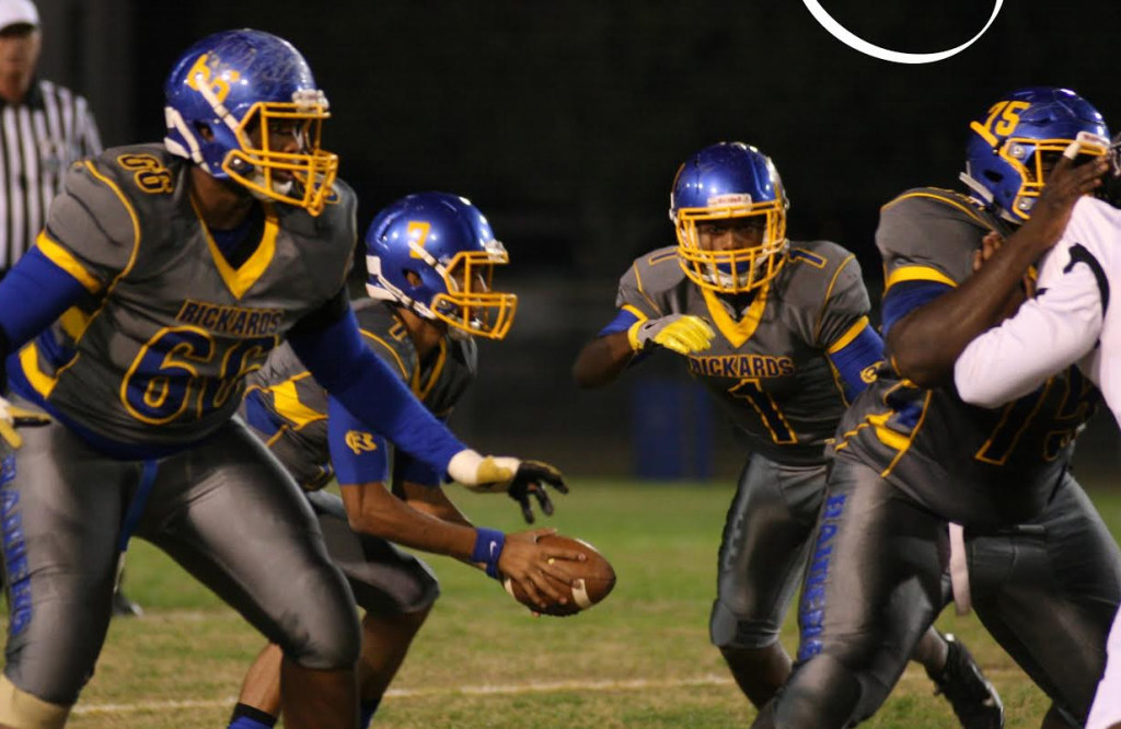 Rickards' quarterback D.J. Phillips (with ball) rushed for 94 yards on 16 carries for the Raiders. He also completed 11 of 24 passing attempts for 264 yards this past Friday night at Cox Stadium. Photo by Jacob Henderson 