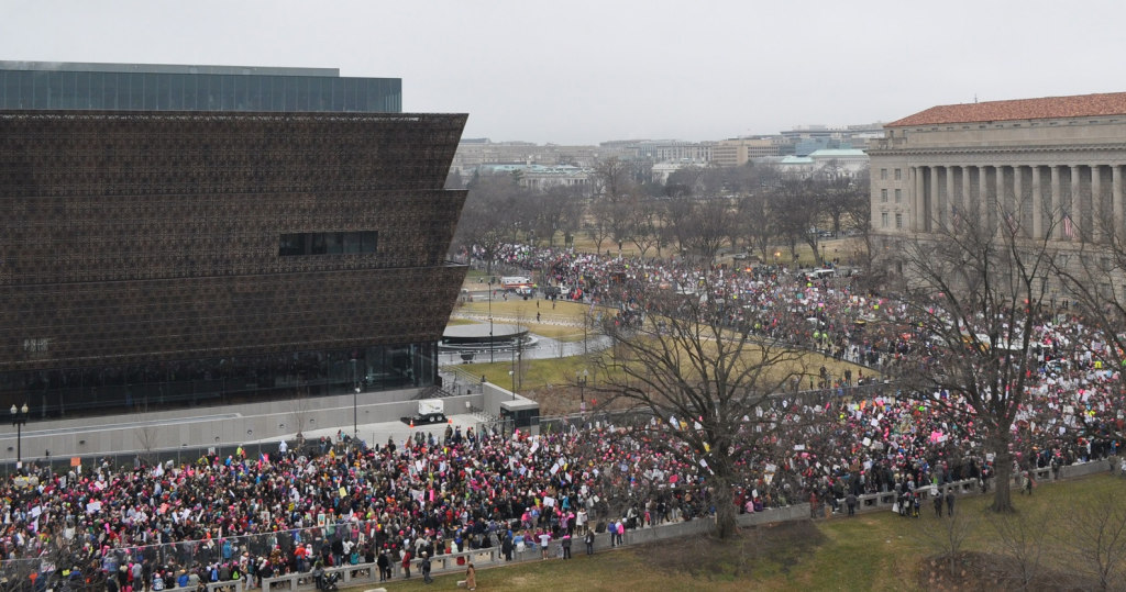 Throngs of women lined D.C. streets for the Jan. 20 women’s march. Estimated at close to a million, there were so many that they could not actually march to the White House as planned. Still, President Trump got the message for justice. This photo shows activists wrapped around the new National Museum for African American History and Culture.  Photo courtesy of  James Zimmerman/Trice Edney News Wire