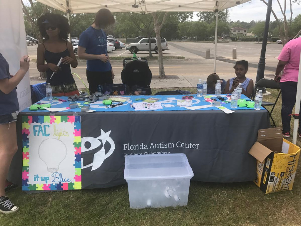 The Florida Autism Center set up a table at the Walk For Autism Event to bring awareness to their institution and answer any questions about the disorder. Photos by Ashia Glover 