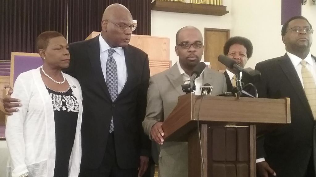 Sen. Audrey Gibson is consoled by Rev. R.B. Holmes during a press conference last week, where members of the clergy called for the ouster of former senator Frank Artiles. Photos by St. Clair Murraine 