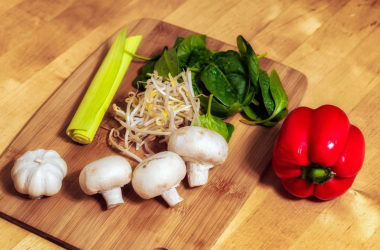 Doctor gives patients veggies with cooking instructions